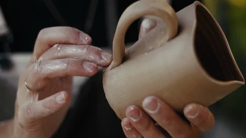 Close-up, Women's Hand Potter Attach to Clay Mug Handle Video stock 123006155