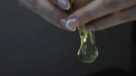 Close-up, Women's Hands Break the Eggshell and Falls into a Bowl of Milk Stock Footage 106261768