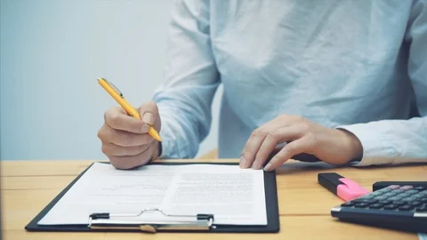 Close-up of women's hands, checking documents. Managing your own small business Stock Footage 104237955