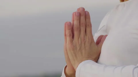 Close-up, Women's Hands Folded Together in Asana Meditation Stock Footage 144820043