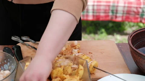Close-up of women's hands that make kebab with potatoes and lard 스톡 동영상 194542618