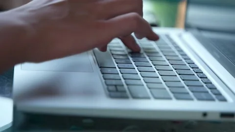 Close-up of women's hands with manicure, actively working on a laptop Video stock 234020818
