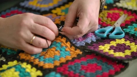 Close-up of women's hands with a needle and thread Stock Footage 166902874