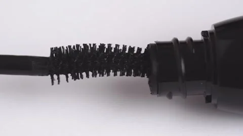 Close-up of women's hands opening and closing mascara. Cosmetics for eyelas.. Stock Footage 257467149