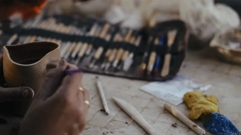 Close-up, Women's Hands of the Potter Process Tool Handle on Clay Mug Stock Footage 123007305