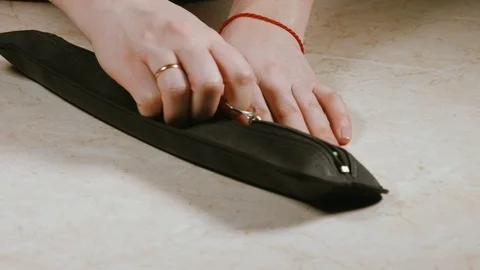 Close - up of women's hands pulling the recorder from the cover Stock Footage 105301868
