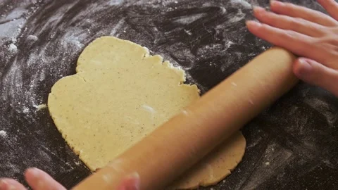 Close-up of women's hands rolling out dough on biscuits Stock Footage 174705133