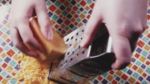 Close-up of women's hands rubbed cheese Stock Footage 101343527