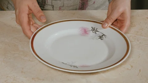Close-up of women's hands, spread the cake on a plate Stock Footage 106466791