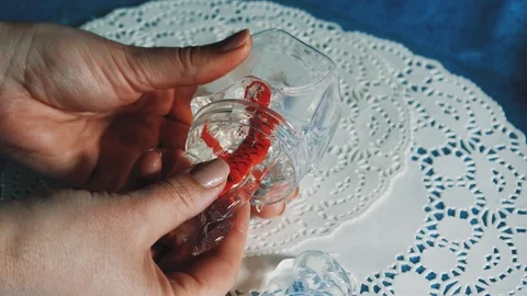 Close-up of women's hands, taking out the slime from the jar Stock Footage 107617966