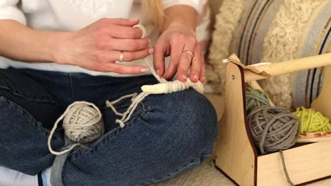 Close up of women's hands weaving macrame in a home workshop.Handmade concept. Stock Footage 154095934