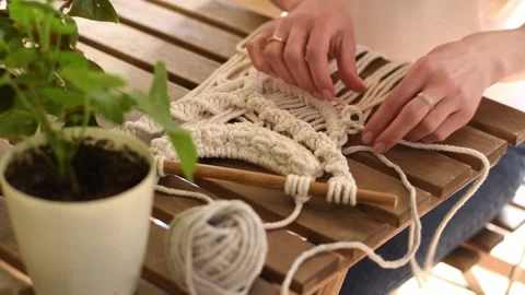 Close up of women's hands weaving macrame in a home workshop.Handmade concept. Stock Footage 154095953