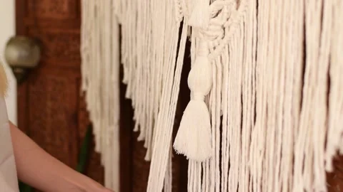 Close up of women's hands weaving macrame in a home workshop. Stock Footage 154342816