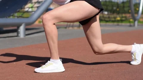 Close-up of women's legs  doing a functional workout. Stock Footage 154846225