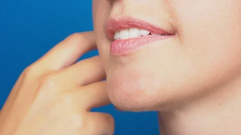 Close-up, women's lips without make-up, the girl touches her face with her hand Stock-Footage 93906021