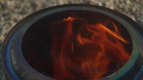 Close up of wood being placed into fire Stock Footage 260540995