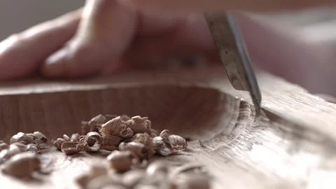 Close up. wood carver processes a oak wood board with a chisel. woodworking p Stock Footage 166082138