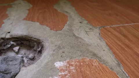 Close-up of wood laminate surface with visible signs of wear and damage, in.. Stock Footage 314979264