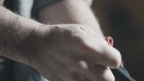 Close up of wood worker putting on his gloves Stock Footage 149292823