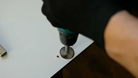 Close up of Wood Worker using an electric hand drill to drill a hole Stock Footage 120338469