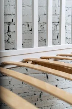 Close-up wooden elements of an arthopedic base of a bed. 스톡 사진