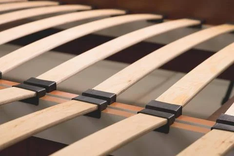 Close-up wooden elements of an arthopedic base of a double bed. Interior s... 스톡 사진