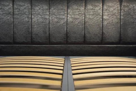 Close-up wooden elements of an arthopedic base of a double bed. Interior s... Stock Photos