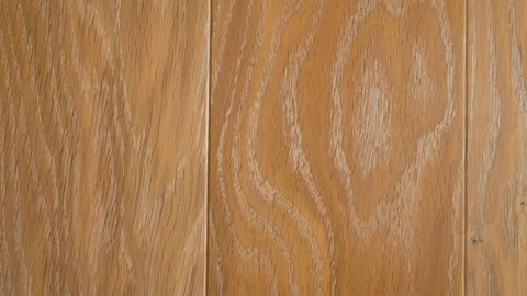 Close-up of wooden floors made of solid planks in light beige tones in a modern  Stock Footage 123296360