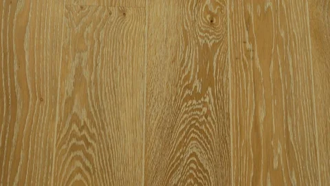 Close-up of wooden floors made of solid boards of light oak in light tones in a  Stock Footage 124066446