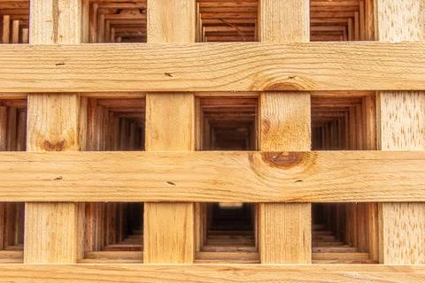 Close-up of a wooden lattice structure with interlocking horizontal and ver.. Stock Photos