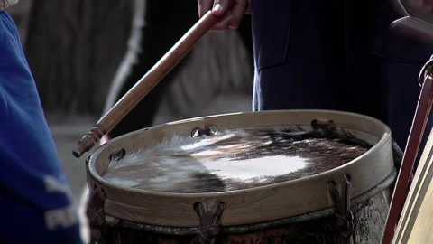 Close Up of Wooden Mallets Beating Rawhide Drumhead on Bombo Leguero - 4K Stock Footage 340634509