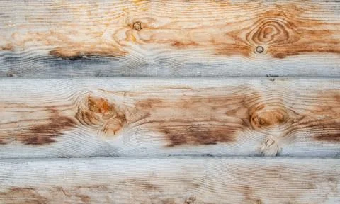 Close-up wooden surface. Old fence made of wooden beams. Grunge wooden texture Stock Photos