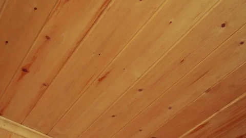 Close up of wooden wall and ceiling corner with warm natural texture Stock Footage 316860791