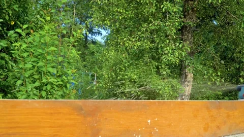 Close up woodworker hands working with electric planer on wooden plank Stock Footage 147351670