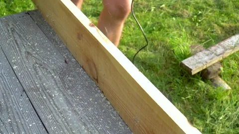 Close up woodworker hands working with electric planer on wooden plank Stock Footage 153844111