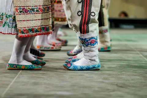 Close up of wool socks on legs of young Romanian female and male dancers in t Stock Photos