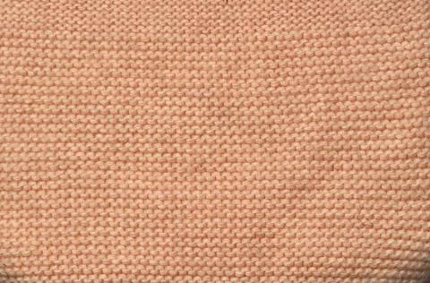 Close-up of the woolen fabric as a background. Yellow, golden background Stock Photos