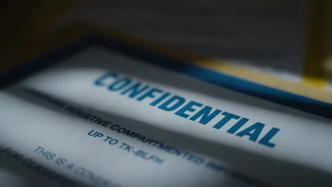 Close up on word confidential marking security clearance on secret documents Stock Footage 316317548