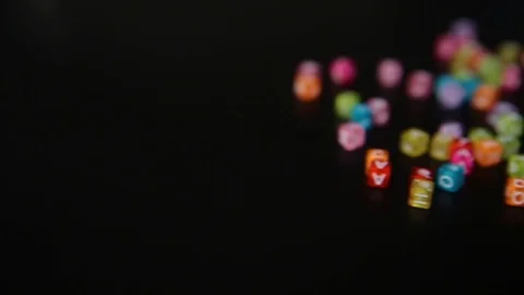 Close-up word "SPRING" collected from colorful cubes with letters on black table Stock-Footage 100577266