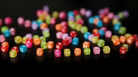 Close-up word "SPRING" collected from colorful cubes with letters on black table Stock Footage 100577271
