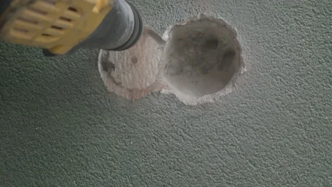 Close Up. Work of a jackhammer. Drilling hole in concrete wall. 스톡 동영상 177372070