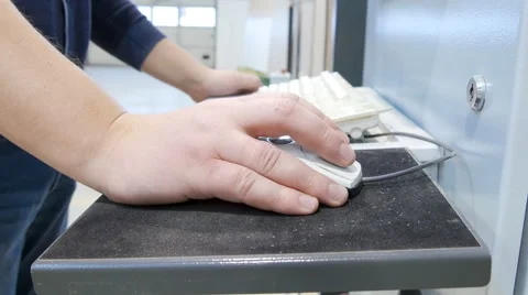 Close-up worker are setting up CNC controling computer on factory Stock Footage 60803913