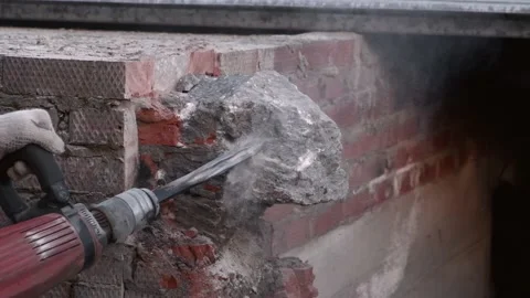 Close-up. Worker breaks the wall with a perforator. Slow motion. Video stock 133294900