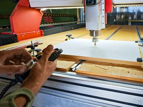 Close-up of a worker calibration process and setting zero point on a CNC rout Stock Photos