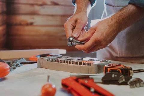 Close up of worker changing the nozzle for wrench Stock Photos
