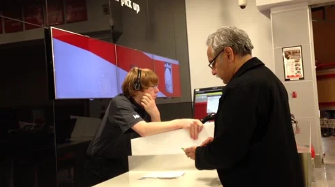 Close up worker at check out counter for customer paying new computer Stock Footage 55385774