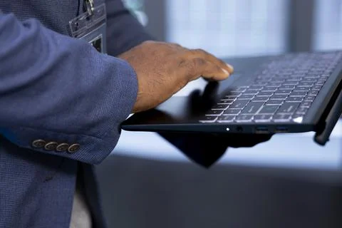 Close up of worker in data center using laptop Stock Photos