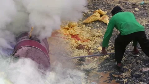 Close-up of worker extracting sulfur with scrap Stock Footage 222210766