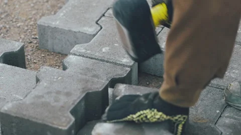 Close-Up, Worker With Gloves Setting Paving Slabs Vidéo 148786916