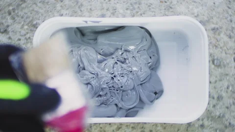 Close up of worker hand mixing protection primer with paintbrush. Stock Footage 116687673